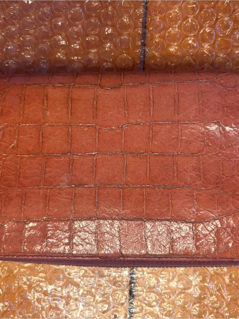 Authentic Miu Miu Croc-Embossed Zip Wallet in Peachy Pink.